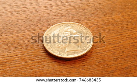 Australia Dollar 20 Cents coin on wooden table