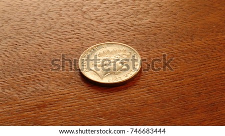 Australia Dollar 20 Cents coin on wooden table
