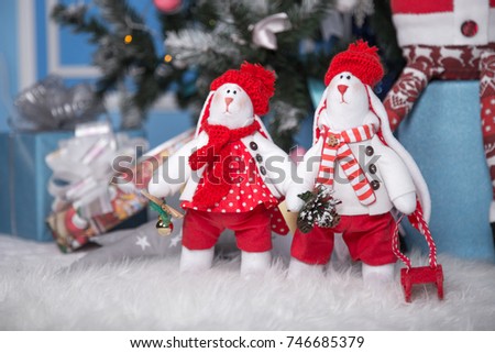 soft toys - hares, under the Christmas tree