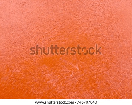 Orange color cement wall texture backdrop