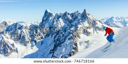 Skiing Vallee Blanche Chamonix with amazing panorama of Grandes Jorasses and Dent du Geant from Aiguille du Midi, Mont Blanc mountain, Haute-Savoie, France Royalty-Free Stock Photo #746718166