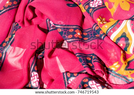 Background texture, pattern. Red maroon fabric. Click on your local heritage with this red, bard and yellow striped silk. This patterned fabric will decorate your design. your work will be exclusive