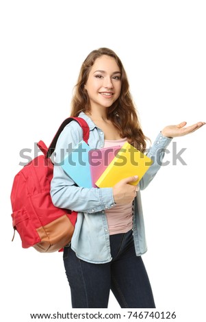 Portrait of student girl with backpack and books on white background
