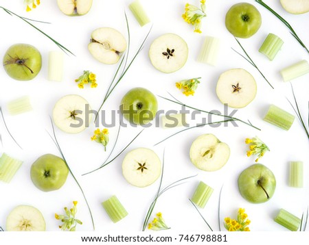 Pattern of green apples. Fruits and flowers on a white background. Wallpaper of fruits. Composition of sliced apples.Top view, flat lay.
 Royalty-Free Stock Photo #746798881