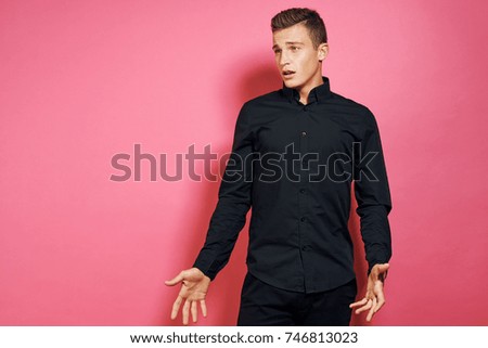 emotions, business man on a pink background, studio                               