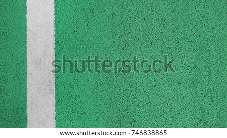 Surface rough of asphalt, Green road with white line, Bicycle lane, Texture Background, Top view