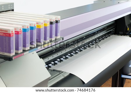 large format ink jet printer with paper roll Royalty-Free Stock Photo #74684176