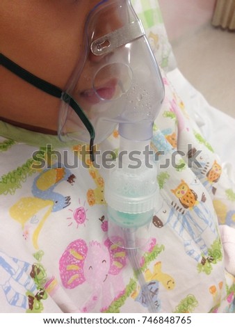 close up Asian boy with mask vapor inhaler