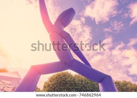 Blue Inflatable Air Dancer in the sunlight outdoors