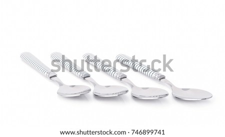 Stainless steel glossy metal kitchen spoon isolated over the white background.