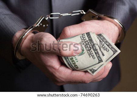 Business man in handcuffs arrested for bribe