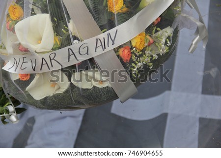 Memorial flowers with the phrase "Never Again" left at the Genocide Memorial Center, Kigali, Rwanda Royalty-Free Stock Photo #746904655