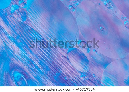 Abstract glitter lights on violet background. Round defocused circles bokeh and shine glitters bright light. Template for design