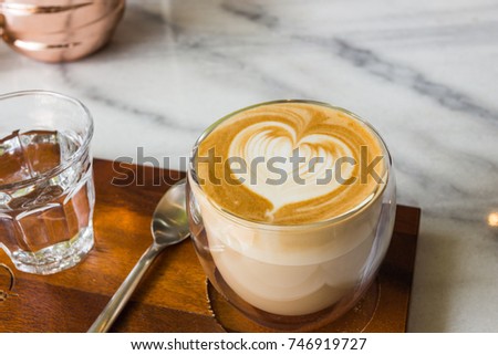 Coffee Art at cafe : Heart mark by cream in coffee break 