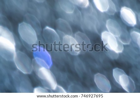 Abstract glitter lights on green background. Round defocused circles bokeh and shine glitters bright light. Template for design