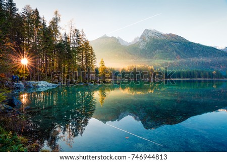 Fantastic autumn sunrise of Hintersee lake. Amazing morning view of Bavarian Alps on the Austrian border, Germany, Europe. Beauty of nature concept background.