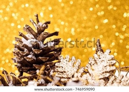Christmas composition of Christmas tree toys on a gold background.