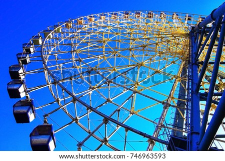 A view of the Ferris wheel, close, part