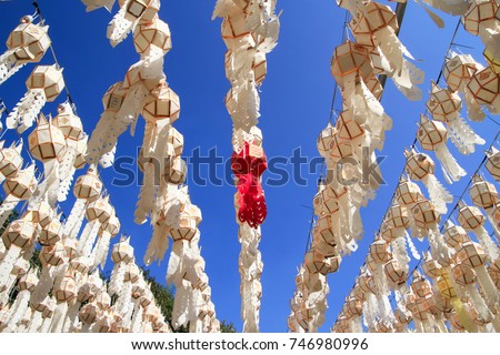 Hanging Northern Thai style lanterns and blue sky.They can see in Northern of Thailand. They are decorated in important festivals such as Loy Krathong Festival, songkran festival etc. Royalty-Free Stock Photo #746980996