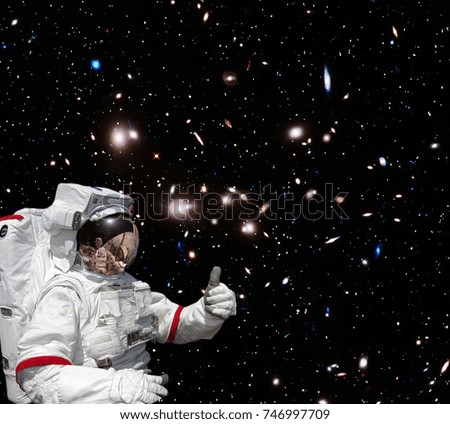 Astronaut and galaxy. The elements of this image furnished by NASA.
