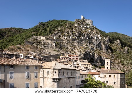 France, Provence-Alpes-Cote d'Azur, Entrevaux, river Var: Skyline panoramic view with ancient citadel of old French small town with blue sky in the background - concept history travel vacation.