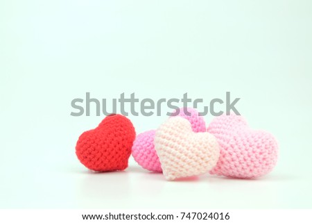 Symbol of love crochet colorful hearts shape on white background. Valentine's Day. Love handmade crochet. Royalty-Free Stock Photo #747024016