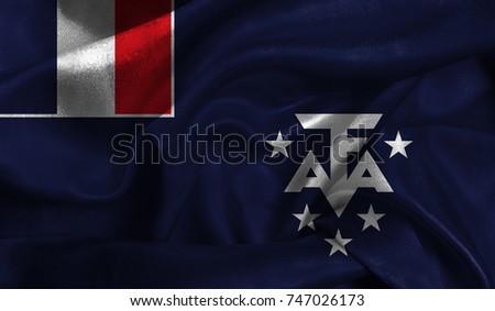 Realistic flag of French Southern and Antarctic Lands on the wavy surface of fabric. This flag can be used in design.