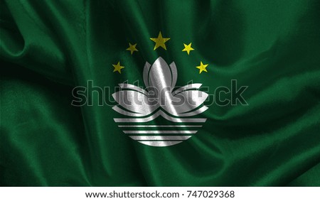 Realistic flag of Macau on the wavy surface of fabric. This flag can be used in design.