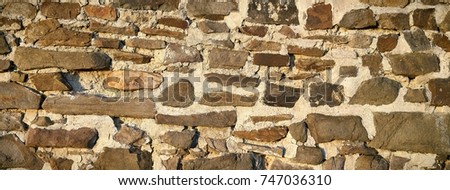 old historic wall of natural stone
