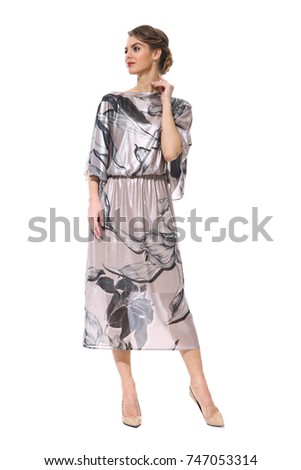 clerk manager business woman in formal print silk dress stiletto heels shoes isolated on white full body portrait