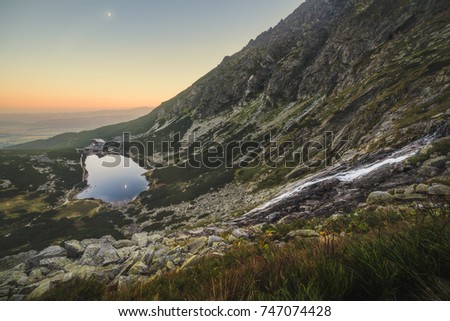 Mountain Lake and Waterfall at Sunset. Velicka Valley, High Tatras, Slovakia.