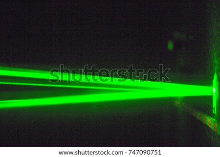 lot of laser beams in a dark room