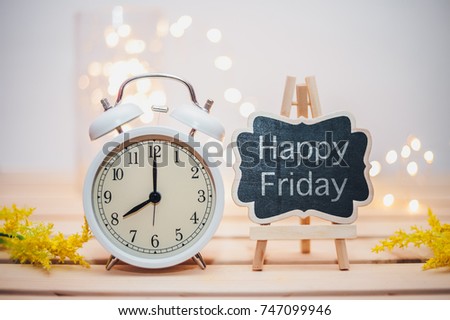 Concept image of Happy Friday with nice retro clock showed 8 o'clock in the morning over nice light bokeh background
