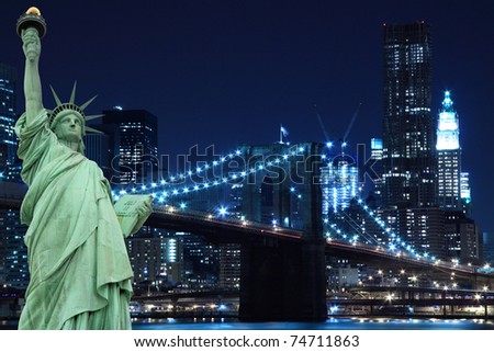 Manhattan Skyline, Brooklyn Bridge and The Statue of Liberty at Night Lights, New York City