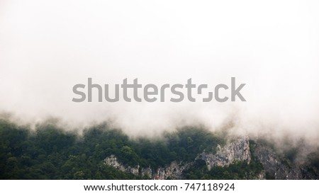 Mountains shrouded in clouds