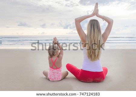woman on the beach practicing yoga