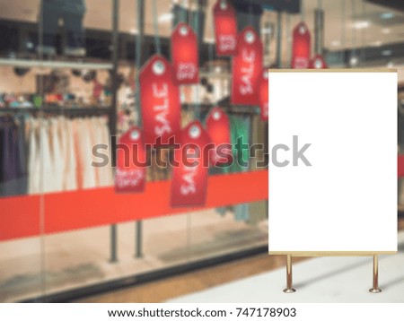 Blank billboard advertising on shopping mall sale blurred background