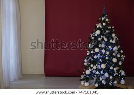 Christmas tree with presents on a red burgundy background