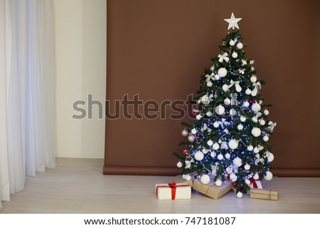 Christmas tree with garlands on brown white background new year gifts