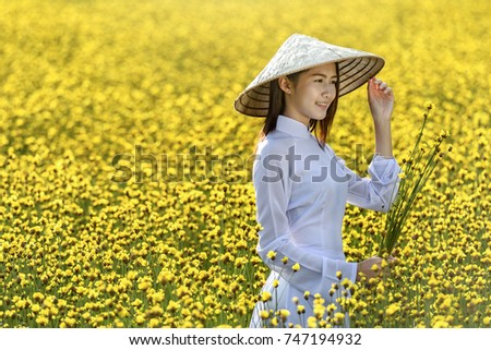 Asian woman wearing traditional Vietnam culture,vintage style,Hanoi,Vietnam Royalty-Free Stock Photo #747194932