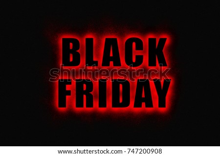 Black Friday sign, large black letters with bright red glowing outline on black background 