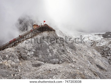 Viewing platform at the Jade Dragon Snow Mountain in clouds, China.