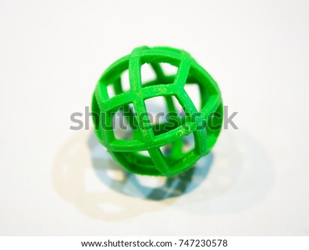 Abstract object of a green color printed by 3d printer on white background. Fused deposition modeling, FDM. Progressive modern additive technology. Concept of 4.0 industrial revolution