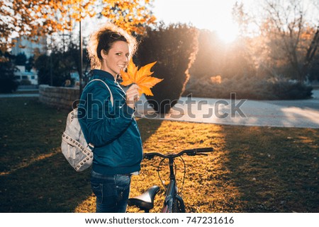 Student girl walk in autumn park