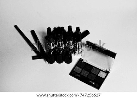 Cosmetic set isolated on white, lipstick. Black and white