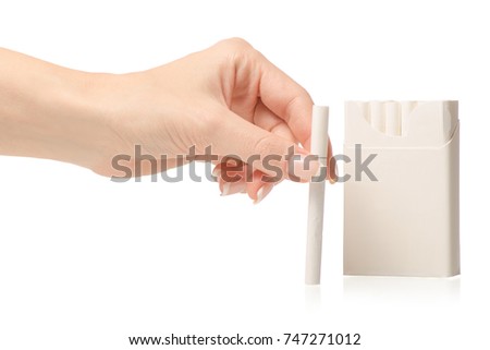 Female hand holding a pack of cigarettes on a white background isolation