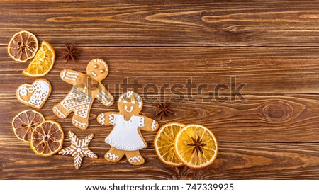 The Christmas or New Year background - Homemade christmas gingerbreads on wooden boards