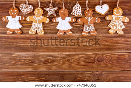 Homemade christmas gingerbreads with ropes on wooden boards, the Christmas or New Year background