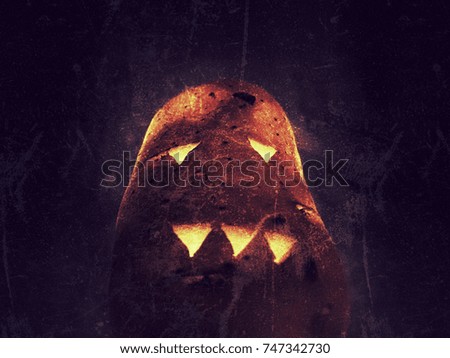 Potato carving scary face. Halloween concept. Horror background.