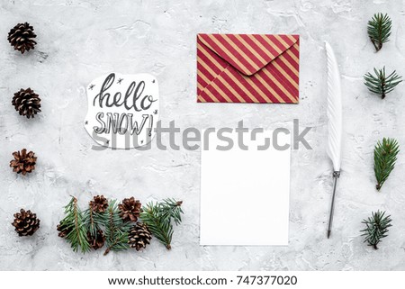 Write greetings. Envelope, paper, pen, hello snow hand lettering on grey background top view pattern